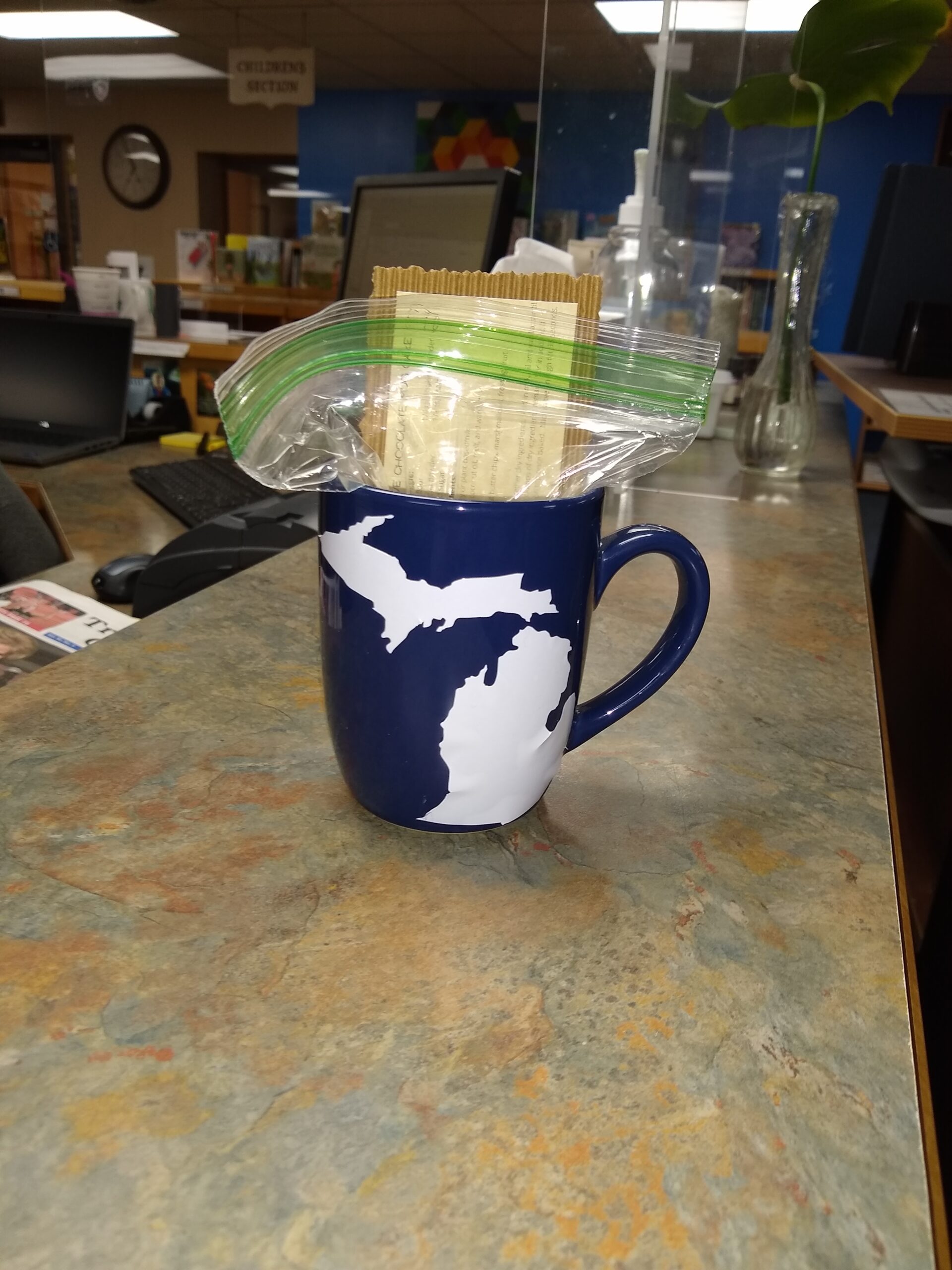 Blue Mug with White Vinyl State of Michigan map applied to it.
